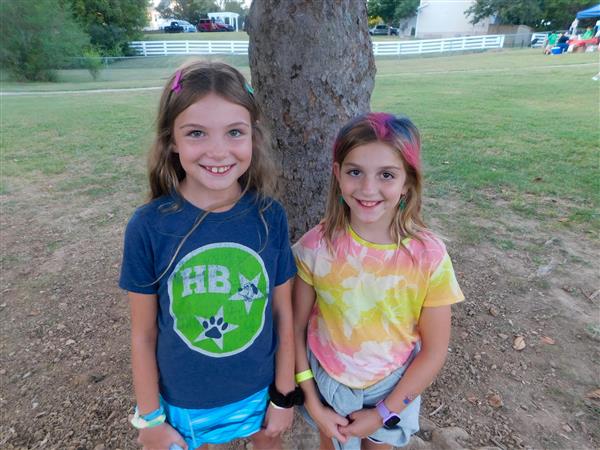 Students outside enjoying a family fun night for their school.